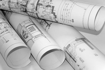 Mehrere zusammengerollte Baupläne